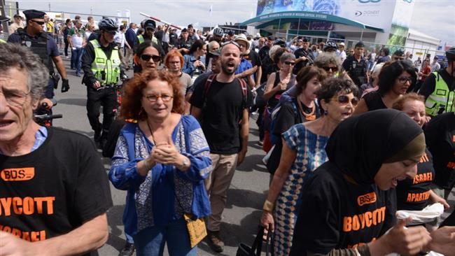 Pro-Palestine activists stage a peaceful protest outside the stall of the Israeli weapons company, Elbit Systems, at the Paris Airshow in France on June 24, 2017.