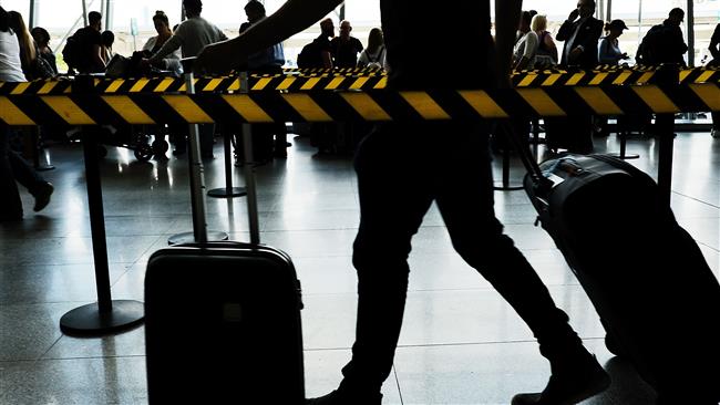 People arrive at John F. Kennedy (JFK) international airport on June 26, 2017 in New York City. (Photo by AFP)
