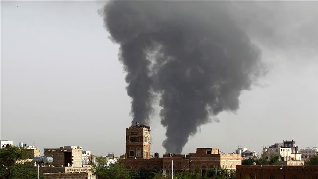 This file photo, taken on July 7, 2015, shows smoke billowing following airstrikes by a Saudi-led coalition on the Yemeni capital, Sana’a. (By AFP)