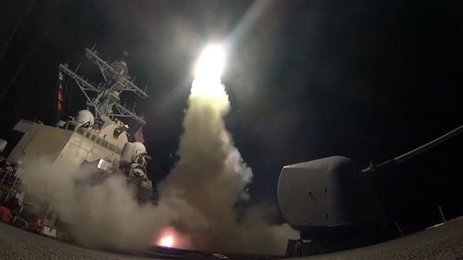 In this image provided by the US Navy, the guided-missile destroyer USS Porter (DDG 78) launches a Tomahawk missile attack against Syria from the Mediterranean Sea on April 7, 2017. (Via AP)