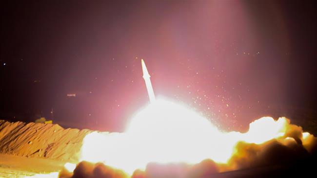 The photo released on June 18, 2017, shows Iran’s Islamic Revolution Guards Corps launching a missile from an undisclosed location in western Iran towards Daesh bases in eastern Syria. (Photo by iribnews.ir)