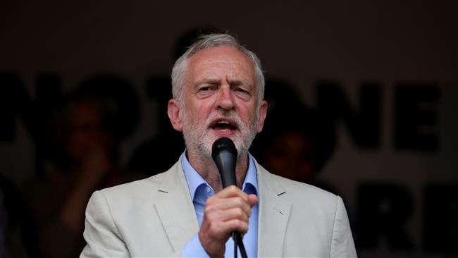 UK opposition Labour party leader Jeremy Corbyn speaks to protesters in Parliament square during an anti-austerity demonstration on July 1, 2017 in London. (Photo by AFP)
