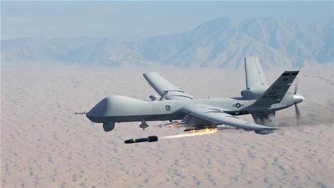 American MQ-9 Reaper drone firing a Hellfire missile.