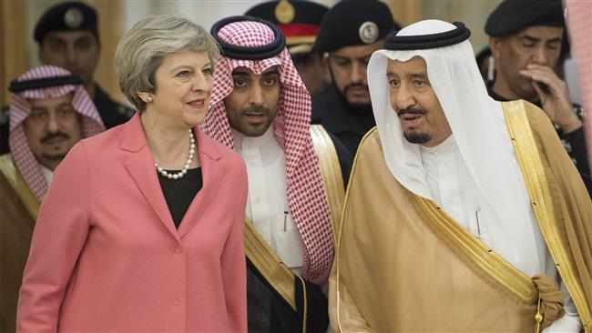 The handout picture provided by the Saudi Royal Palace on April 5, 2017 shows Saudi King Salman bin Abdulaziz Al Saud (R) receiving British Prime Minister Theresa May (L) in Riyadh. (Via AFP)