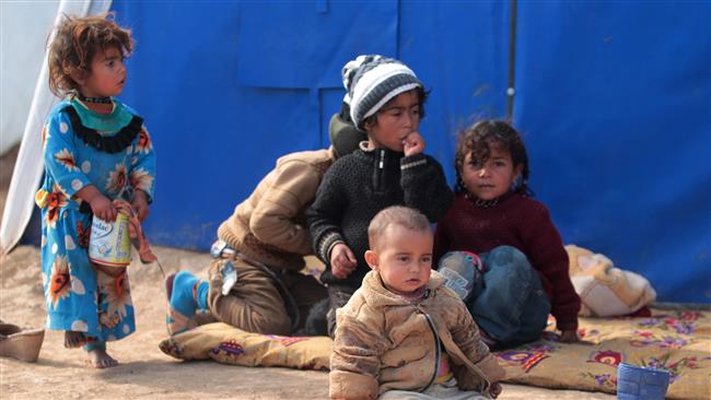 Displaced Iraqi children sit at the al-Agha camp near the city of Tal Afar, southwest of the Iraqi city of Mosul, February 16, 2017. (Photo by AFP)