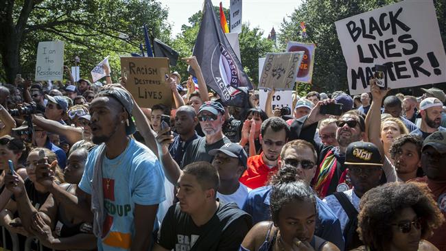 Counterprotesters gather during a planned Ku Klux Klan protest on July 8, 2017 in Charlottesville, Virginia. (Photo by AFP)