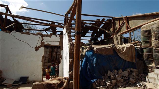 Yemeni children stand inside their house which was destroyed several months ago in an airstrike by Saudi Arabia, on March 12, 2016, in the capital Sana’a. (Photo by AFP)