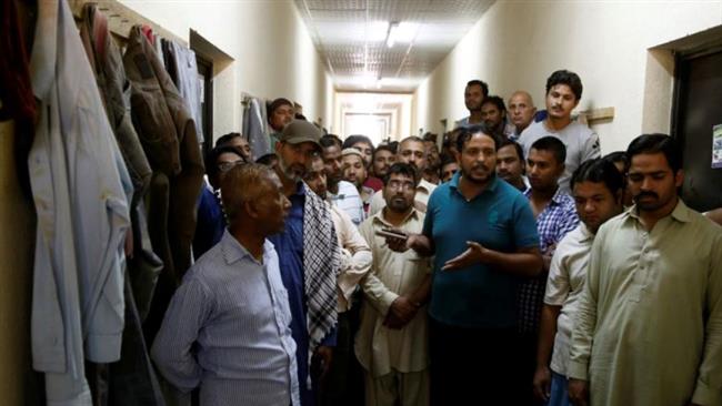 South Asian migrant workers gather as they speak to journalists at their accommodation in Qadisiya labor camp, Saudi Arabia, August 17, 2016. (Photo by Reuters)