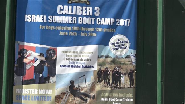 The file photo by Israeli daily Haaretz shows a poster for the Caliber 3 military training camp in July 2017.