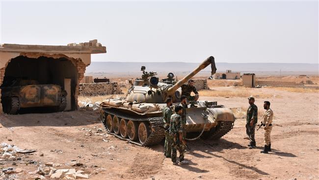 Syrian government forces inspect an area recently recaptured from the Daesh terrorist group in a mountain range near the village of Khanasser, in the Aleppo province on July 2, 2017. (Photos by AFP)