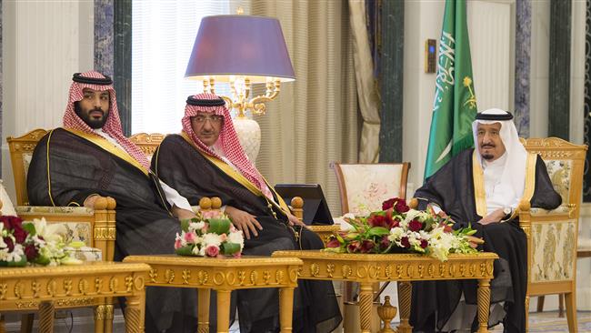 A handout picture provided on April 24, 2017 shows Saudi Arabia’s King Salman (R), the then-crown prince Mohammed bin Nayef (C), and the then-deputy crown prince Mohammed bin Salman in the capital, Riyadh. (Via AFP)