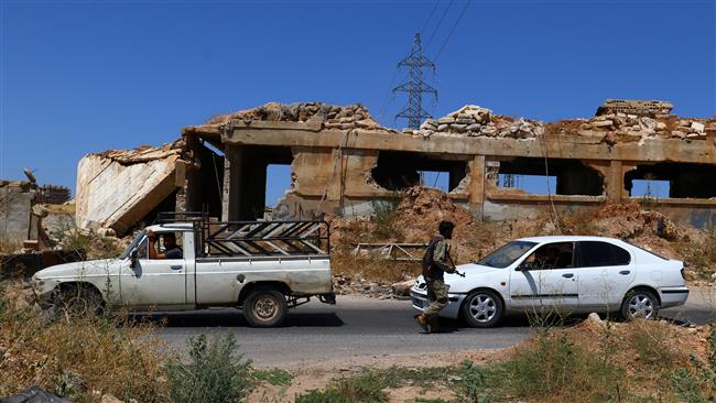 Members Jaish al Fateh Takfiri front guard a checkpoint in Idlib city, Syria, on July 18, 2017. (Photo by Reuters)