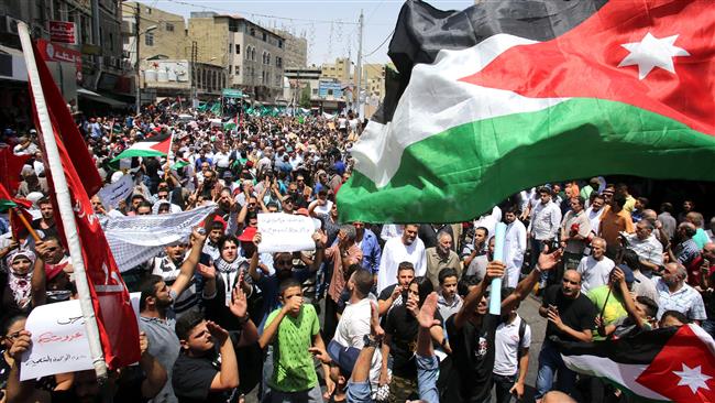 Jordanians shout slogans during a demonstration in Amman following Friday prayers on July 21, 2017, to protest against new Israeli restrictive measures at al-Aqsa Mosque. (Photo by AFP)