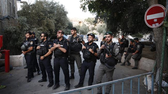Israeli security forces hold a position as Palestinian worshippers gather to pray outside the al-Aqsa Mosque compound in the occupied Old City of Jerusalem al-Quds on July 25, 2017. (Photos by AFP)