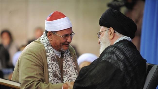 The file photo shows Mohammed Abdel Wahhab el-Tantawi (L), the well-known Egyptian reciter of the holy Quran, shaking hands with Leader of the Islamic Revolution Ayatollah Seyyed Ali Khamenei during a trip to Iran in 2009.