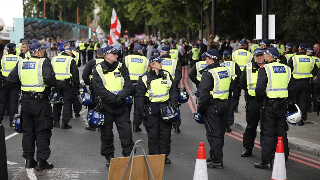 British police officers are pictured at a demonstration organized by the far-right group the English Defense League (EDL) in central London on June 24, 2017. (Photo by AFP)