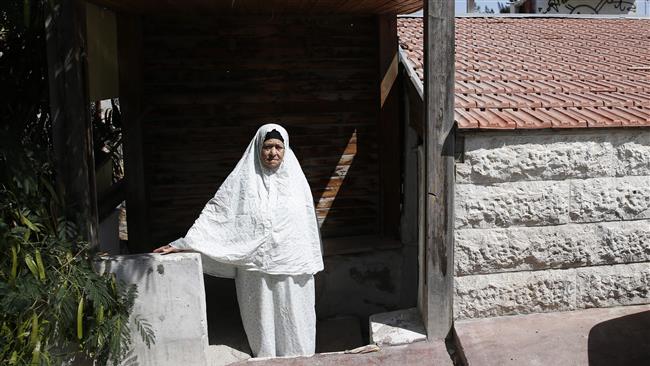 Fahamiya stands outside her family house in Israel-occupied East Jerusalem al-Quds, August 1, 2017. (Photo by AFP)