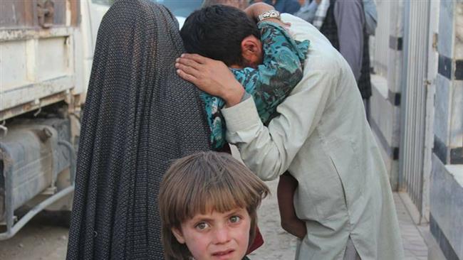 The members of an Afghan family try to comfort each other after losing loved ones in a Taliban raid on the Shia village of Mirza Olang in the northern Afghan province of Sar-e Pol on August 6, 2017.