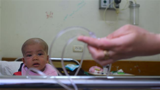 A Palestinian girl suffering from cancer is seen at al-Rantisi pediatric hospital in Gaza City on April 6, 2017. (Photos by AFP)