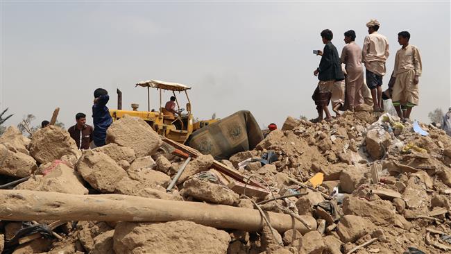 People stand on the debris of a house destroyed by a Saudi air strike on the outskirt of the northwestern Yemeni city of Sa’ada on August 4, 2017. (Photo by Reuters)