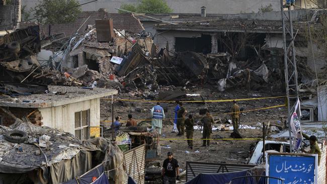 Pakistani security officials are seen at the site of an overnight bomb explosion in Lahore on August 8, 2017. (Photo by AFP)