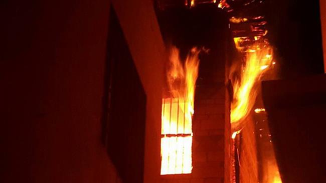 File photo of a building set afire in the eastern Saudi Arabian town of Awamiyah