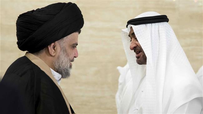 A handout image provided by United Arab Emirates News Agency (WAM) on August 14, 2017 shows Sheikh Mohamed bin Zayed al-Nahyan (R), Abu Dhabi’s crown prince, shaking hands with Iraqi cleric Muqtada al-Sadr following a meeting in Abu Dhabi. (Via AFP)