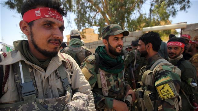 Members of the Iraqi pro-government Popular Mobilization Units (Hashd al-Sha’abi) gather in a street in the modern town of Hatra, near the eponymous UNESCO-listed ancient city, southwest of the northern city of Mosul, on April 28, 2017. (Photo by AFP)