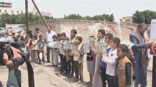 This frame grab captured from footage provided by AFP shows Yemeni children protesting Saudi Arabia’s invasion of the country in front of the UN building in the capital Sana’a on August 13, 2017.