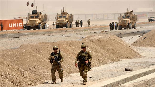 US soldiers walk at the site of a Taliban bombing attack in Kandahar on August 2, 2017. (Photo by AFP)