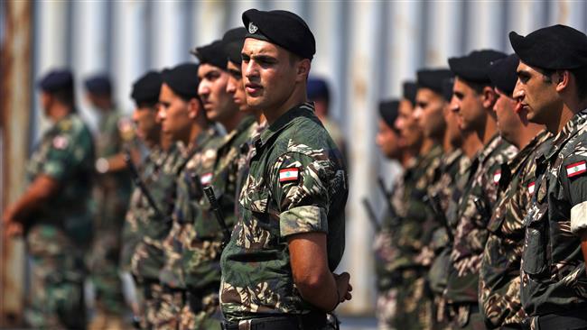 Lebanese army soldiers stand guard at the port of Beirut on August 14, 2017. (Photo by AFP)