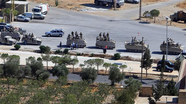 Lebanese army forces are seen in military tanks in the village of Ras Baalbek on August 19, 2017. (Photo by Reuters)