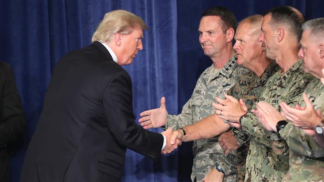 US President Donald Trump greets military leaders before his speech on Afghanistan at the Fort Myer military base on August 21, 2017 in Arlington, Virginia.