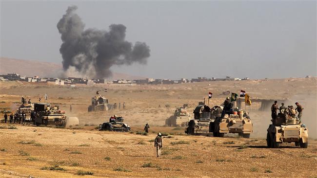 Iraqi forces, backed by Popular Mobilization Units (Hashd al-Shaabi), advance towards the city of Tal Afar, west of Mosul, after the Iraqi government announced the beginning of the operation to retake it from the control of Daesh Takfiri terrorists on August 22, 2017. (Photo by AFP)