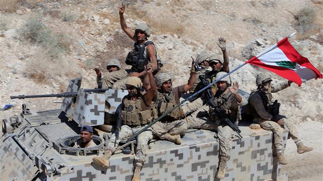 Lebanese army forces sit on their military vehicles in the Lebanese town of Ras Baalbek on August 21, 2017. (Photo by Reuters)