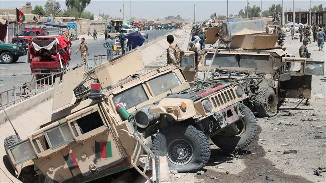 Afghan soldiers inspect damaged army vehicles after a bomb attack in Lashkargah, Helmand Province, Afghanistan, August 23, 2017. (Photo by Reuters)