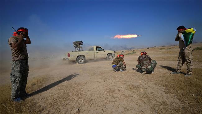 Iraqi pro-government fighters from the Popular Mobilization Units (Hashd al-Shaabi) launch a rocket towards Daesh Takfiri militants on the outskirts of Tal Afar, Iraq, on August 22, 2017.