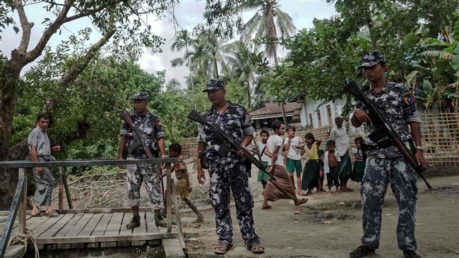 Mynamar border police stand guard at Ngayantchaung village on July 13, 2017. (Photo by AFP)
