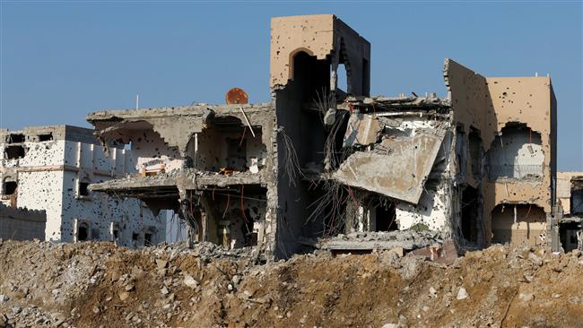Remains of buildings are seen following Saudi Arabia