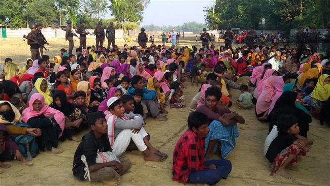 This photo, taken on December 25, 2016, shows Rohingya Muslims from Myanmar who tried to cross the Naf River into Bangladesh. (By AFP)