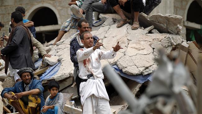 A Yemeni man covered in blood stains reacts as they search for survivors in the debris of buildings hit in a Saudi air strike in the residential southern Faj Attan district of the capital, Sana’a, on August 25, 2017. (Photo by AFP)