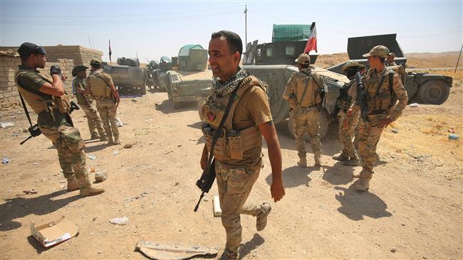 Iraqi forces advance towards al-‘Ayadiya district, north of Tal Afar, during the ongoing battle to oust the last pockets of Daesh Takfiri terrorists from the area on August 30, 2017.