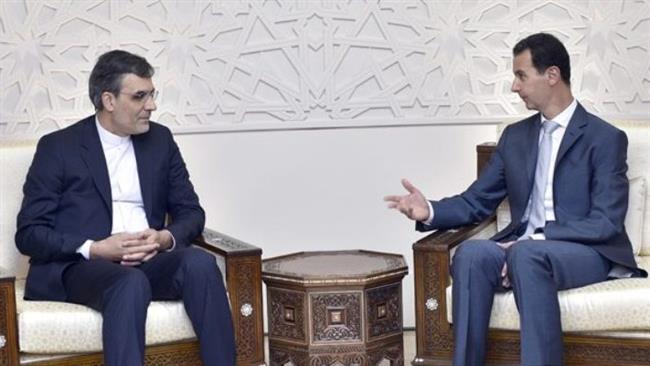 Syrian President Bashar al-Assad (R) and visiting Iranian Deputy Foreign Minister for Arab and African Affairs Hossein Jaberi Ansari meet in Damascus on August 30, 2017. (Photo by SANA)