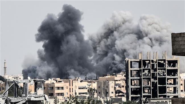 Heavy smoke billows following an airstrike conducted by the US-led coalition in the western neighborhoods of Raqqah, in Syria, on July 17, 2017. (Photo by AFP)