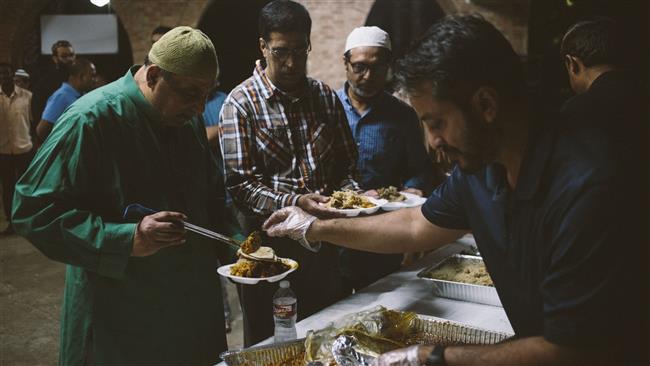 Displaced families gather for dinner at the Brand Lane Islamic Center in Stafford, Texas on August 31, 2017.