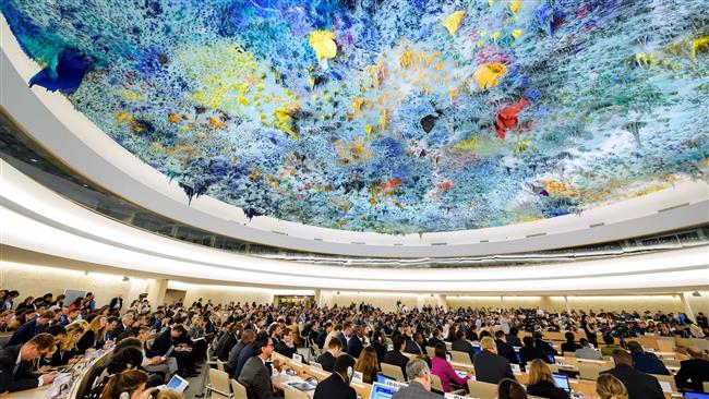Delegates participate at a meeting of UN Human Rights Council in Geneva on June 6, 2017. (Photo by AFP)