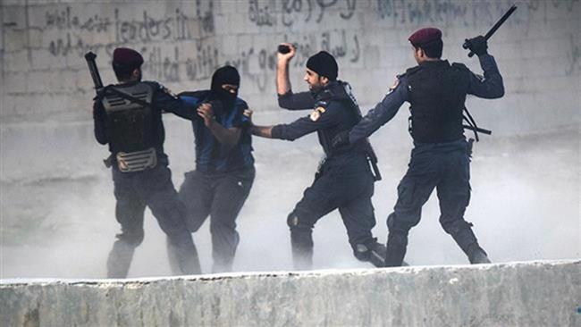 In this file photo, Bahraini regime forces arrest a protester during demonstration against the ruling regime in the village of Shakhora, west of Manama. (By AFP)