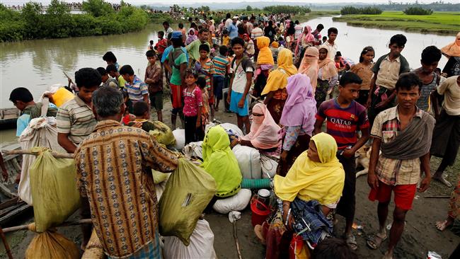 Rohingya refugees are seen waiting for a boat to cross the border through the Naf River in Maungdaw, Myanmar, September 7, 2017. (Photo by Reuters)