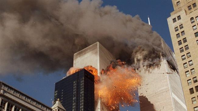 Smoke billows from the north tower of the World Trade Center and flames and debris explode from the south tower on September 11, 2001. (Photo by AP)