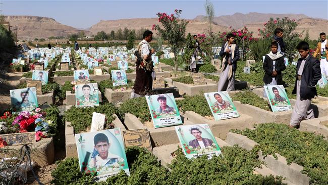 People visit a graveyard allocated for fighters from the Houthi Ansarullah movement in the ongoing Yemeni conflict in the northwestern Yemeni city of Sa’ada on September 3, 2017. (Photo by Reuters)